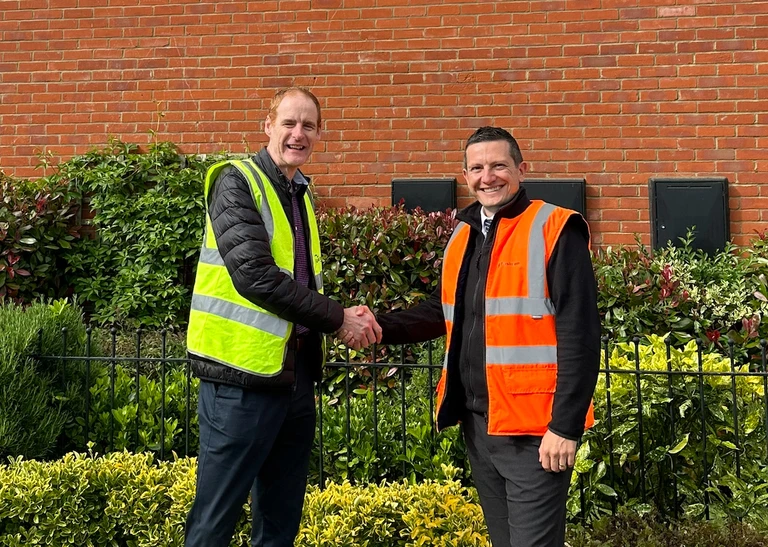 Grand Union's Dave Lakin shaking hands with Persimmon's David Ablett at the Furlongs in Towcester