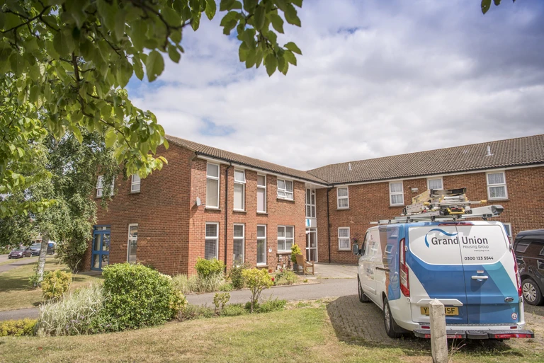 Image of a Grand Union van outside of a supported living scheme.