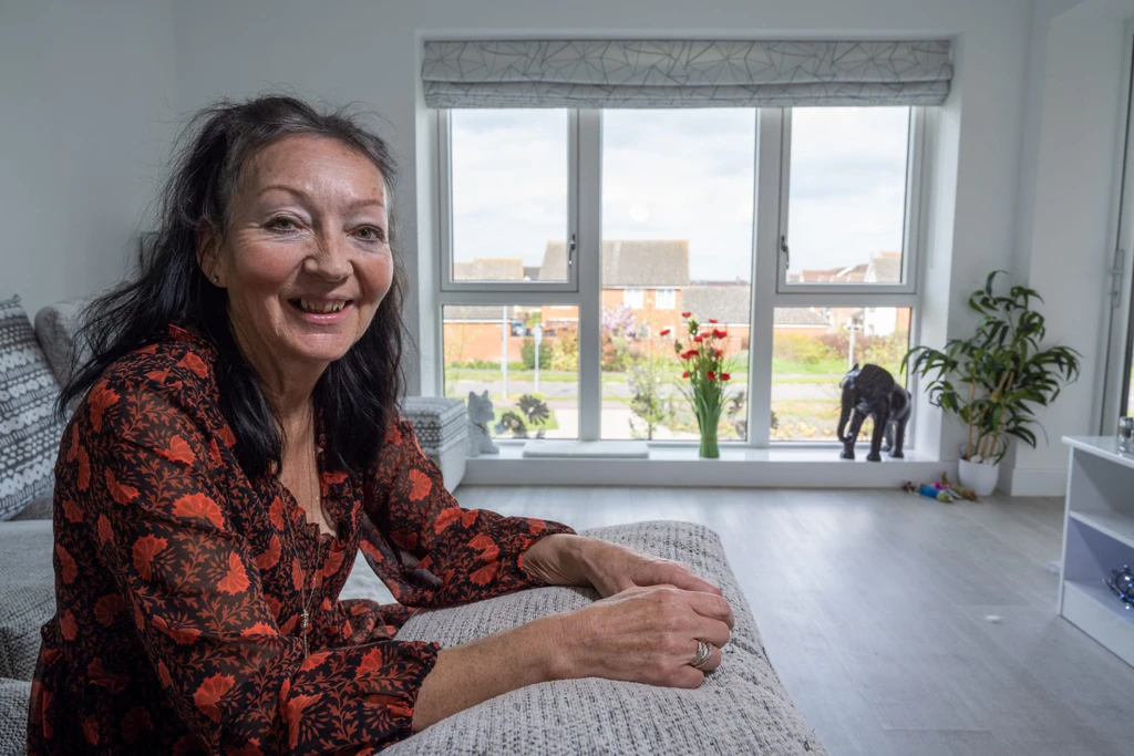 Jacky in her living room at Chamomile Gardens in Biggleswade