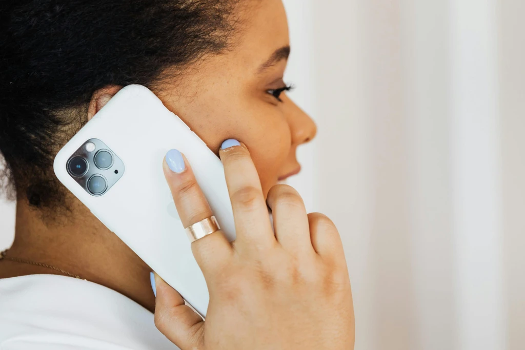 Person holding a mobile phone to their ear