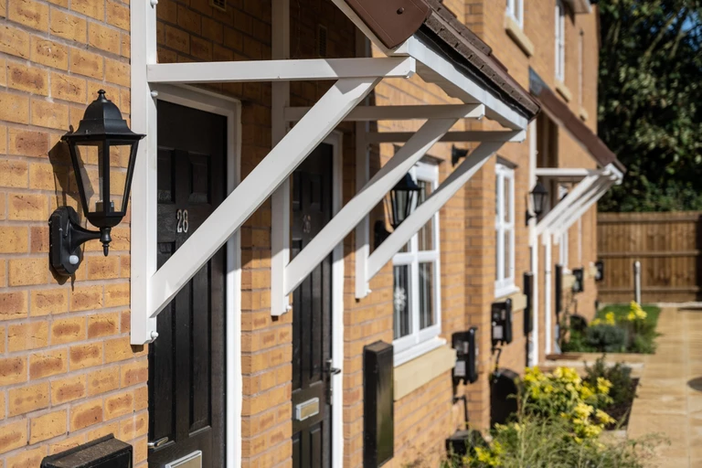Front doors of a row of new houses