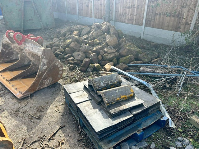 Pile of paving stones, roof tiles and rocks.
