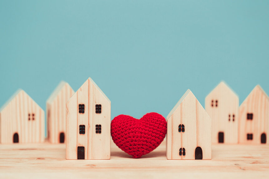 A love heart sat between two model houses