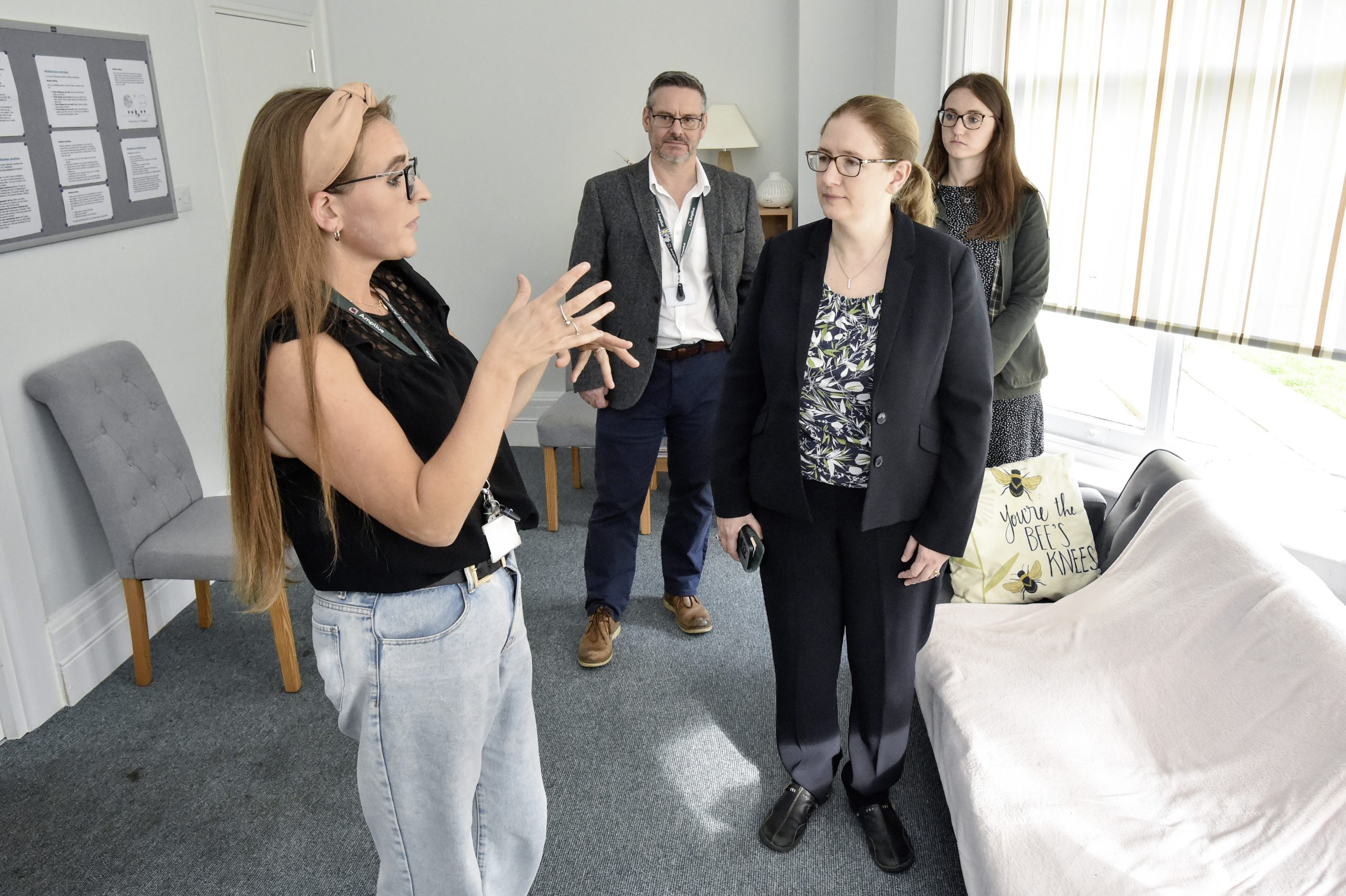 Lady talking to a group of people